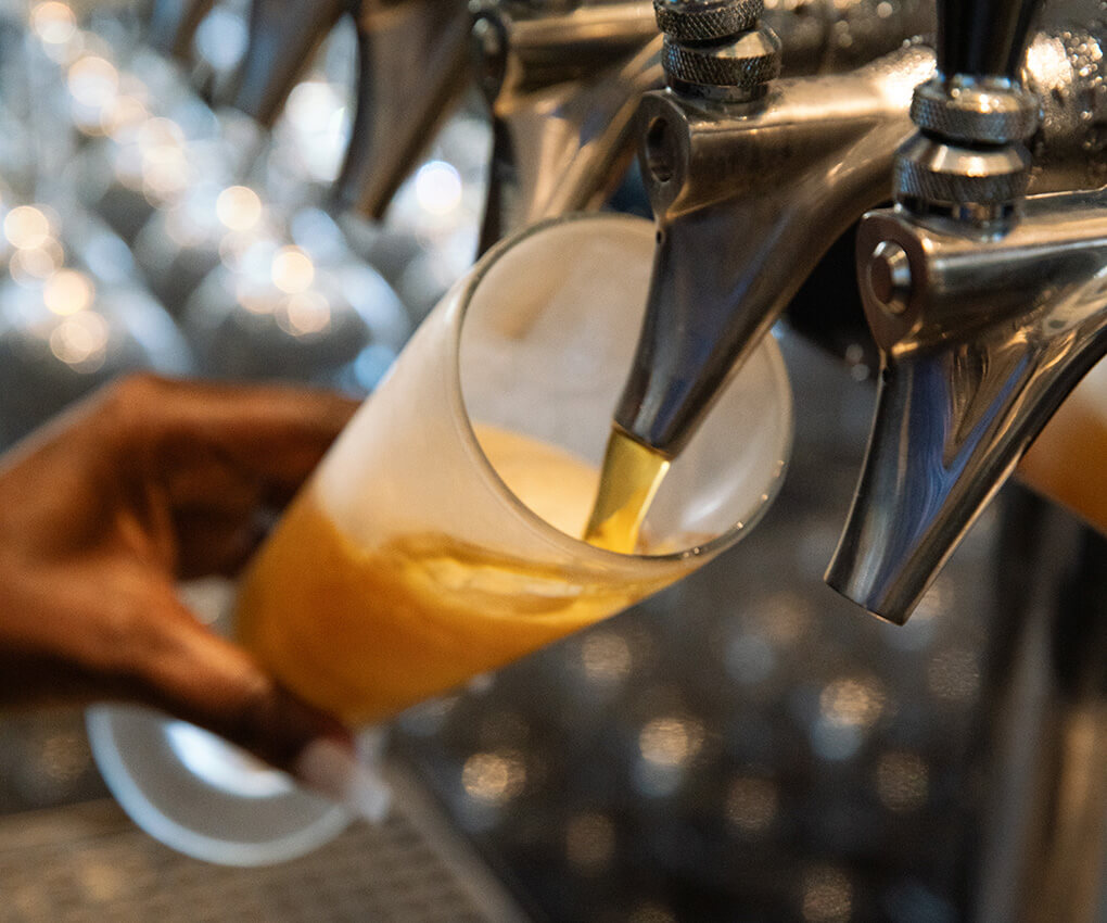 Pouring beer from tap